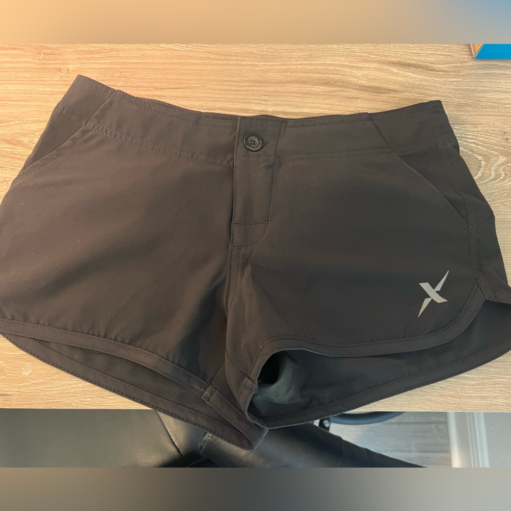 New Xotic Outdoors women’s Black Hybrid Performance shorts. New without tags